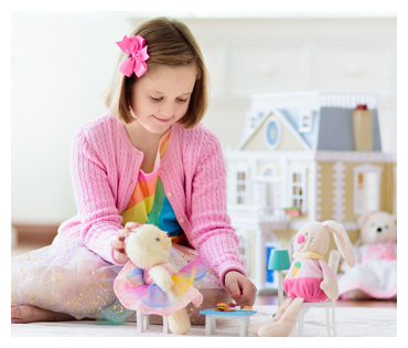 Girl playing with dolls